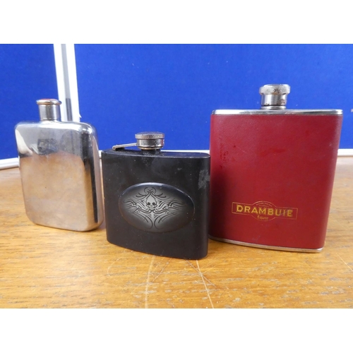 102 - A collection of hip flasks and more.