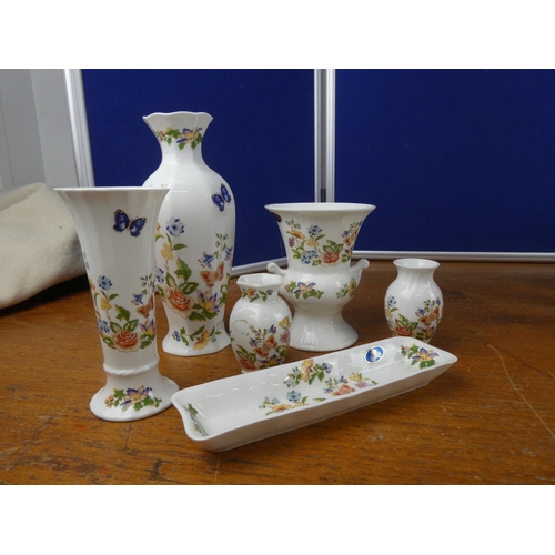 104 - A large collection of pottery to include Belleek, Aynsley Orchard Gold and more.