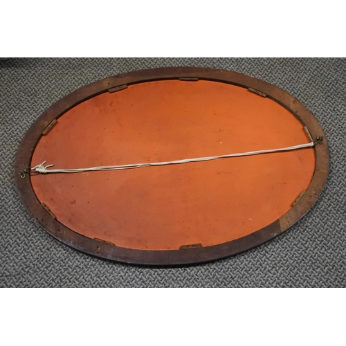 224 - An antique mahogany and inlay mirror, measuring 56x81cm approximately.