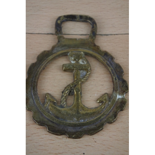 269 - Three antique horse brasses.