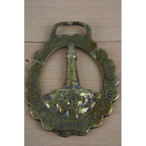 269 - Three antique horse brasses.