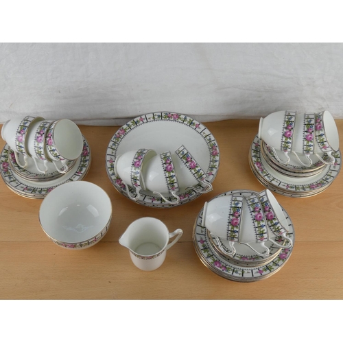547 - An antique Trellis Rose tea set.