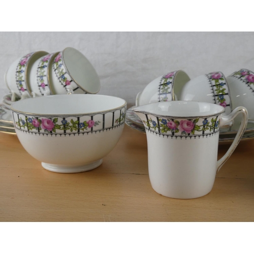 547 - An antique Trellis Rose tea set.