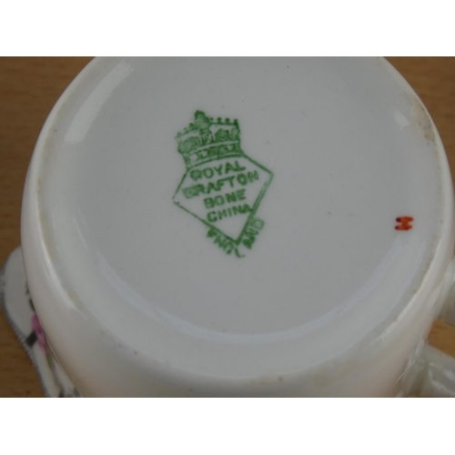 547 - An antique Trellis Rose tea set.