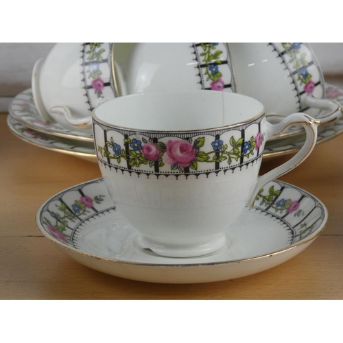 547 - An antique Trellis Rose tea set.