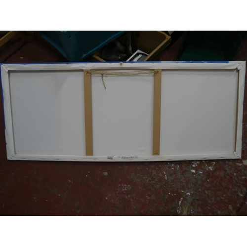 556 - A framed canvas print of a beach scene.