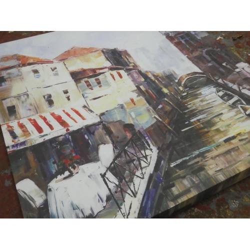 557 - A framed canvas print.