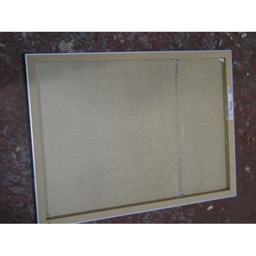 558 - A framed canvas picture of the Eiffel Tower.