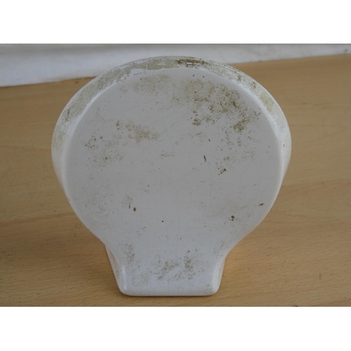 568 - A 1979 North West 200 plaque and a vintage 'Joey Dunlop' souvenir ornament (a/f).