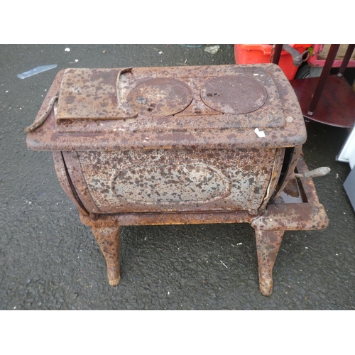 574 - An antique cast iron stove for restoration.