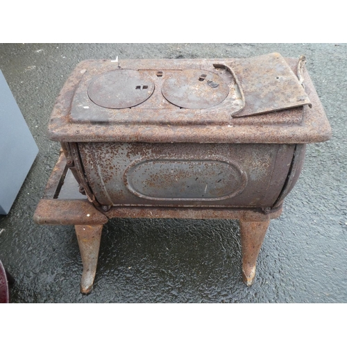 574 - An antique cast iron stove for restoration.
