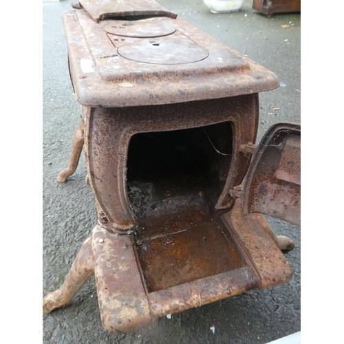 574 - An antique cast iron stove for restoration.