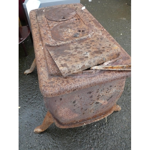 574 - An antique cast iron stove for restoration.