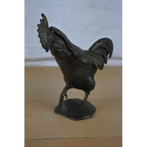 36 - An unusual antique metal rooster figure.