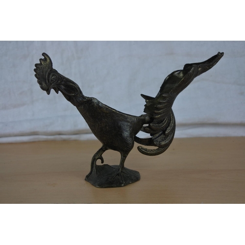 36 - An unusual antique metal rooster figure.