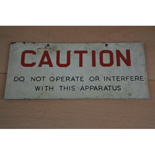 39 - A metal 'Caution' sign. Approx 10x23cm.