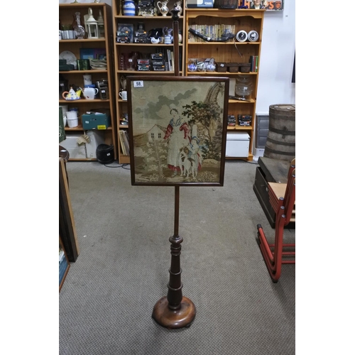 58 - An antique mahogany pole screen with tapestry panel. Approx 62cm tall.