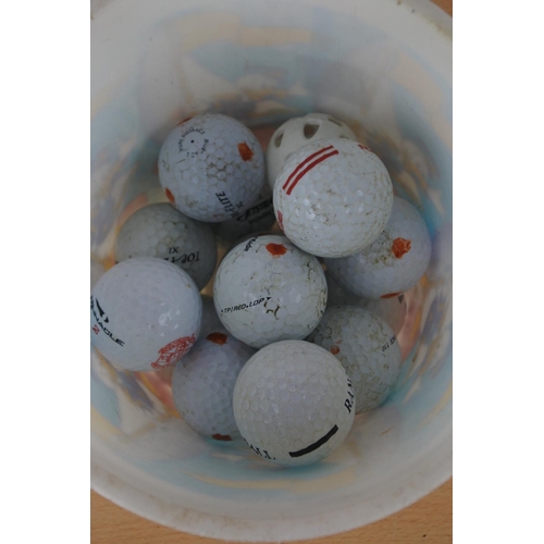 66 - A lot of golf balls.