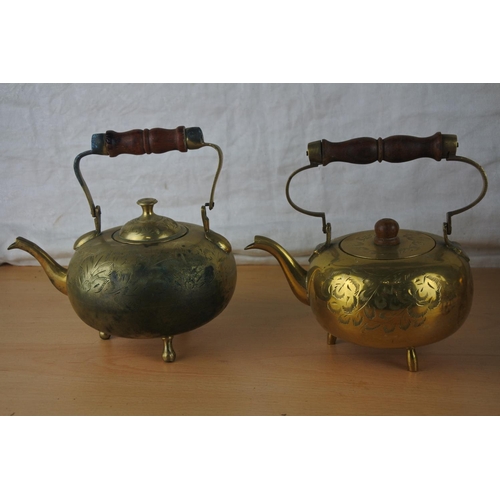 67 - Four vintage brass teapots.