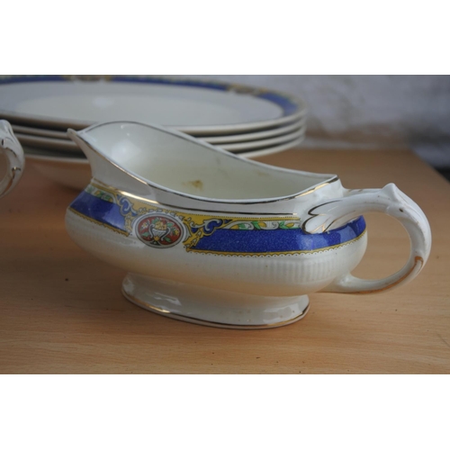 71 - A part W H Grindley & Co dinner ware to include lidded tureen, soup bowls, sauce boat and more.