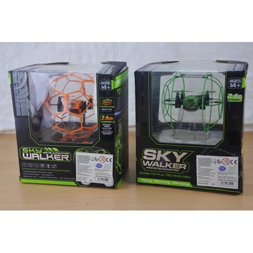 76 - Two boxed Helic Max Sky Walker toys.