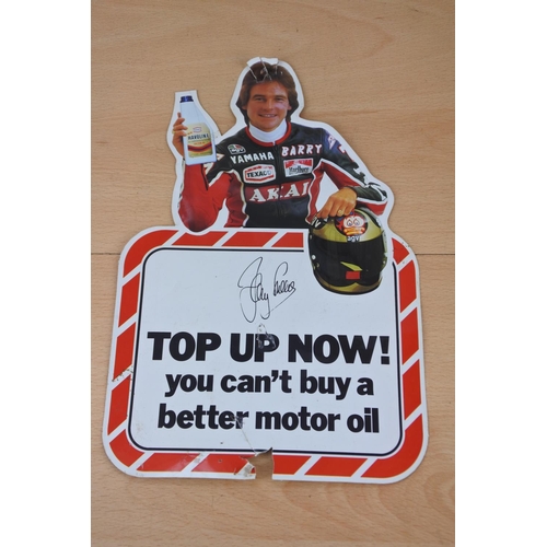 79 - A vintage advertising sticker for Texaco motor oil, autographed by Barry Sheene. Approx 28x19cm.