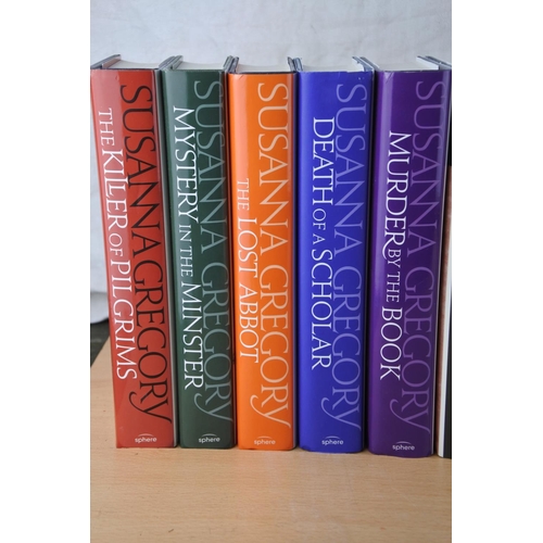 87 - A collection of 12 Susanna Gregory books.