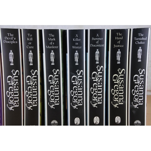 87 - A collection of 12 Susanna Gregory books.