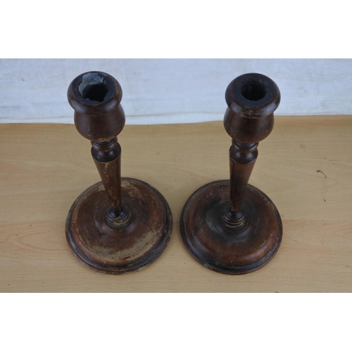 9 - A pair of vintage handmade wooden candlesticks. Approx 30cm.