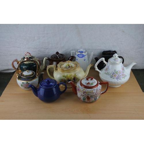 94 - A lot of ceramic teapots.