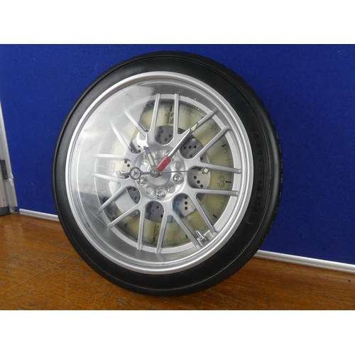 125 - A novelty tyre wall clock.