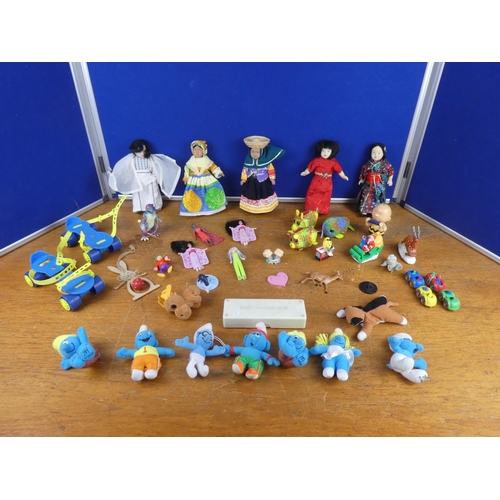 135 - An assortment of vintage dolls and more.