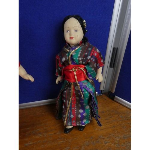 135 - An assortment of vintage dolls and more.