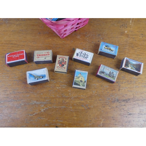 137 - A collection of vintage cigarette boxes in a wicker basket.