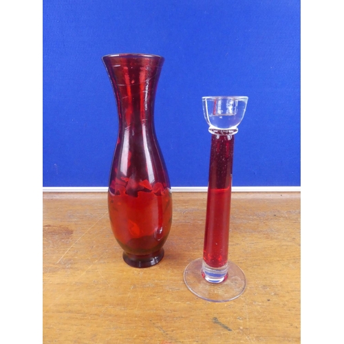 140 - A vintage ruby glass vase and candleholder. Tallest 35cm.