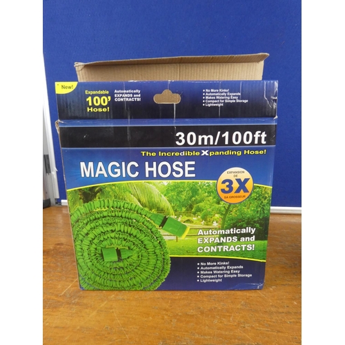 152 - A boxed 100ft magic hose.