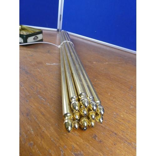 161 - 14 brass stair rods with brackets. Approx 77cm.