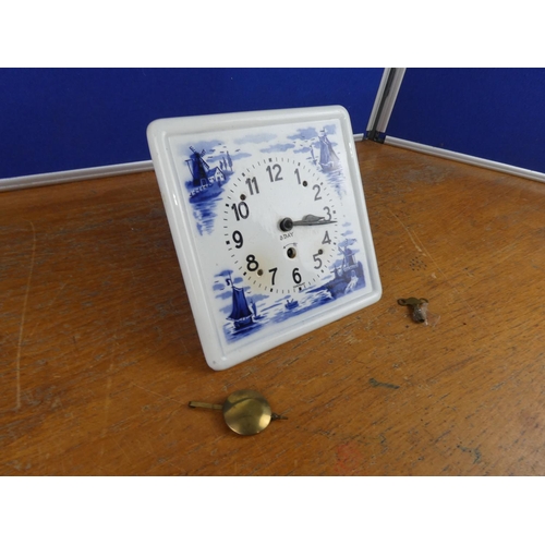 180 - A vintage ceramic German wall clock.