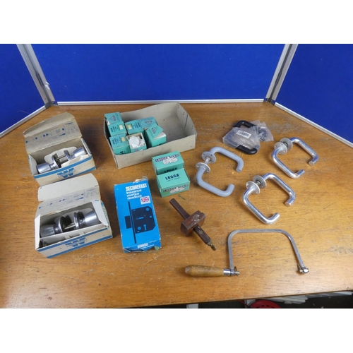 184 - An assorted lot of boxed cylinder locks, door handles and more.