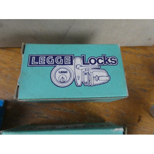 184 - An assorted lot of boxed cylinder locks, door handles and more.