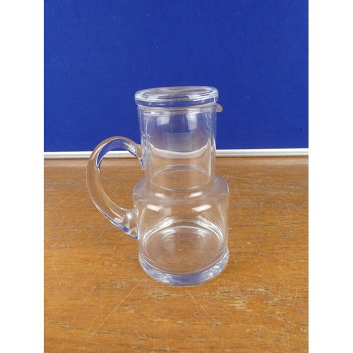 199 - A glass jug and tumbler set.