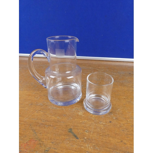 199 - A glass jug and tumbler set.