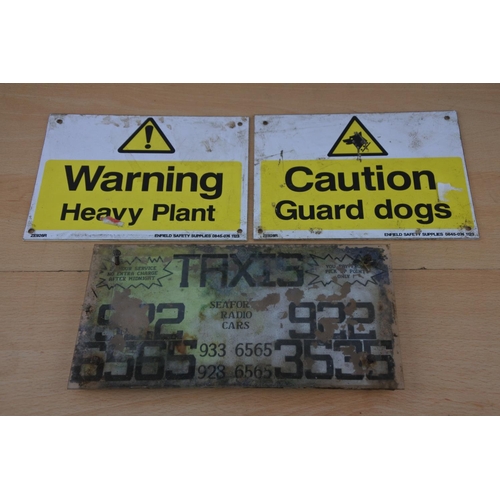 215 - Two plastic warning signs and a Taxis sign Seaforde Radio Cars'. Approx 14x20cm.