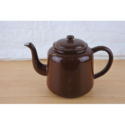 216 - A vintage brown enamel teapot.