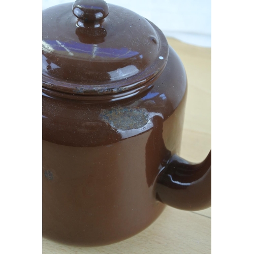 216 - A vintage brown enamel teapot.