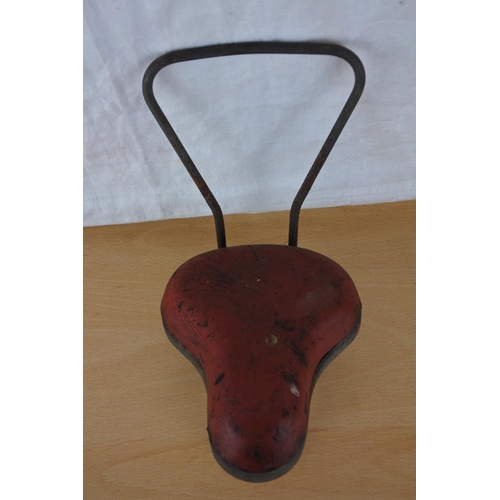 218 - A child's vintage Derretts Safety Saddle.