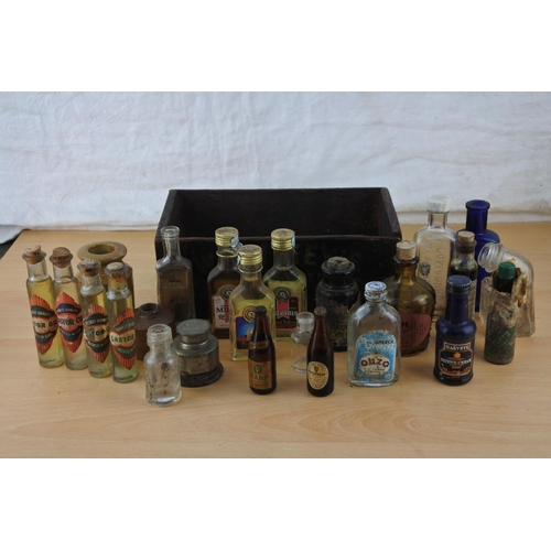 219 - A small wooden box and a lot of miniature bottles to include Castrol Oil, Kay's Linseed Compound, st... 