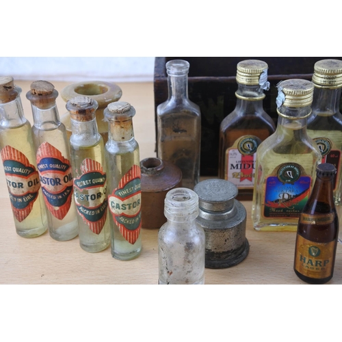 219 - A small wooden box and a lot of miniature bottles to include Castrol Oil, Kay's Linseed Compound, st... 