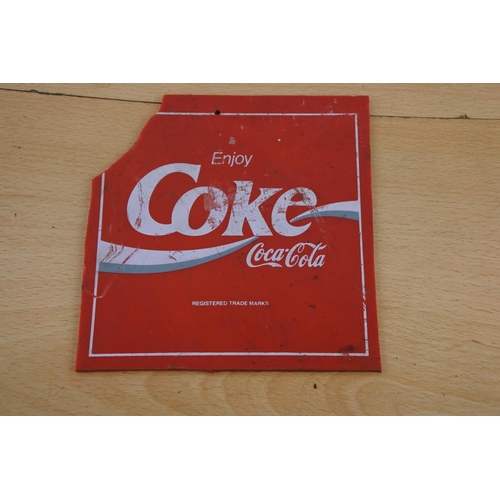 222 - A Coca Cola advertising sign (a/f). Approx 14x14cm.