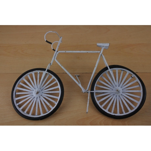 231 - A miniature bicycle with rubber tyres.